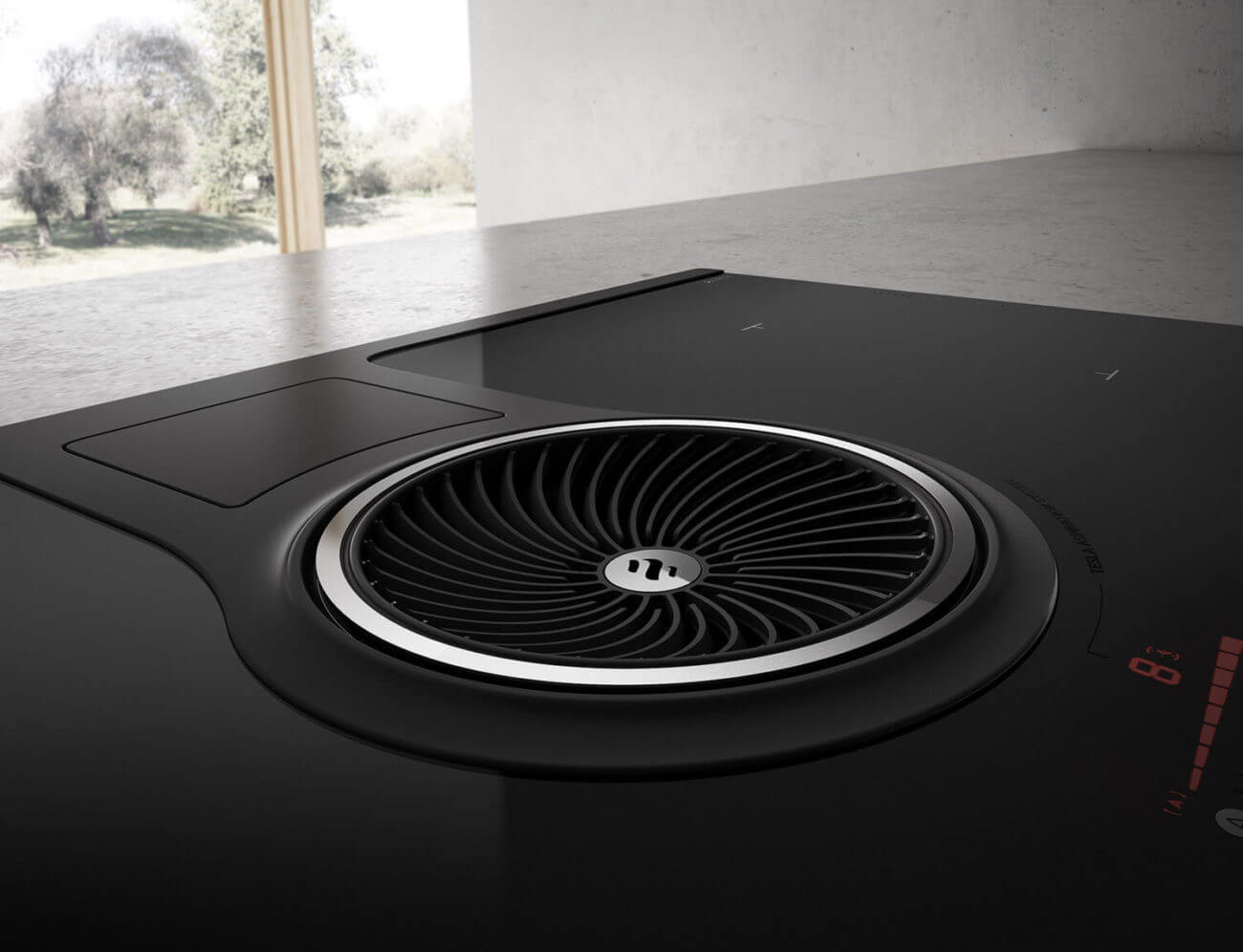 Beim italienischen Hersteller wird viel Wert auf Design gelegt. So auch beim Induktions-Kochfeld mit integriertem Dunstabzug nach unten. Foto: elica